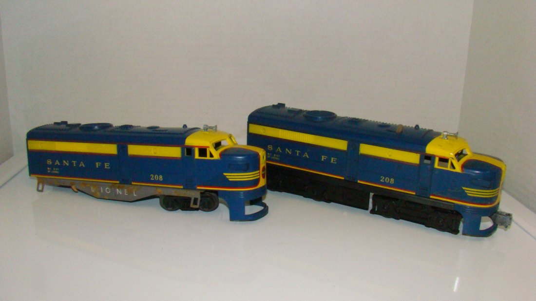2 LIONEL NO. 208 SANTA FE LOCOMOTIVES- 1 AS-IS: 2 LIONEL NO. 208 SANTA FE LOCOMOTIVE - O GAUGE - BUILT AUGUST 1957 - UNTESTED - 1 LOCOMOTIVE AS-IS NO WHEELS - FROM THE COLLECTION OF A 97 YEAR OLD LIONEL REPAIRMAN AND COLLECTOR