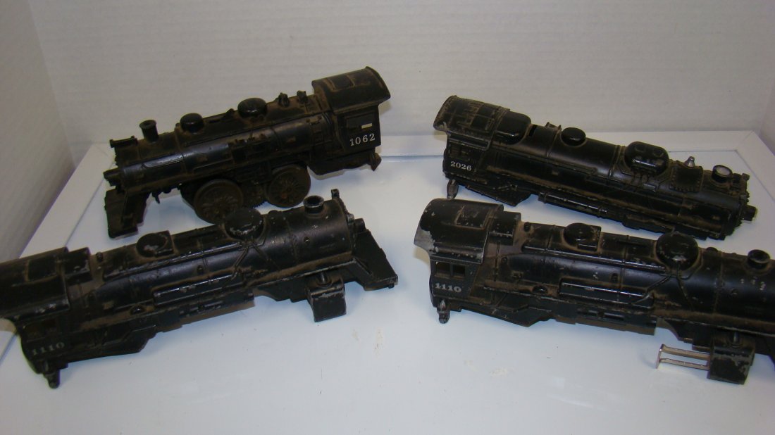 3 LIONEL LOCOMOTIVE SHELLS & 1 AS-IS LOCOMOTIVE: 2 LIONEL NO. 1110 LOCOMOTIVE SHELLS - LIONEL NO. 2026 SHELL AND A LIONEL NO. 1062 LOCOMOTIVE - NEEDS REPAIR - UNTESTED - GOOD FOR PROJECTS FROM THE COLLECTION OF A 97 YEAR OLD CERTIFIED LIONEL REPAIR 