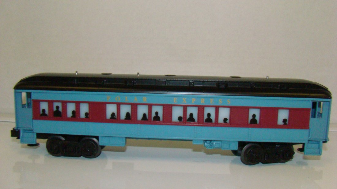 LIONEL POLAR EXPRESS ILLUMINATED PASSENGER CAR: LIONEL POLAR EXPRESS ILLUMINATED PASSENGER CAR - NO BOX - O GAUGE - UNTESTED - LIGHT BLUE AND BURGANDY - FROM THE ESTATE OF A 97 YEAR OLD CERTIFIED LIONEL REPAIR PERSON