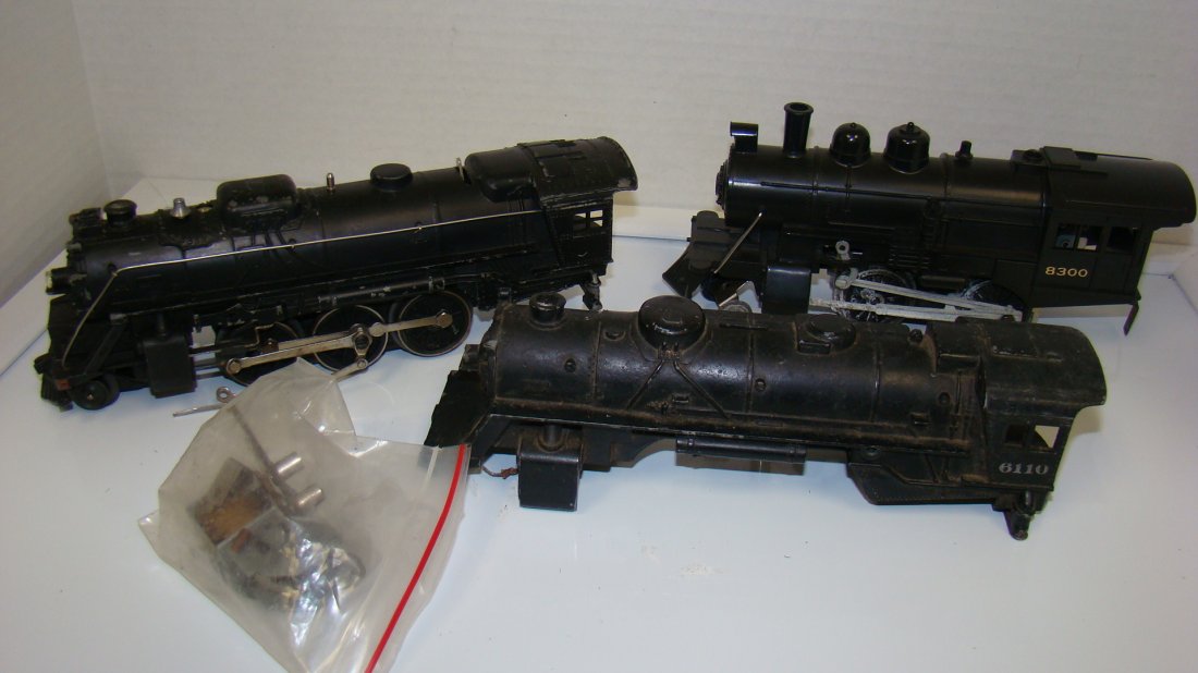 LIONEL 8300-027 & 6110 LOCOMOTIVES-AS-IS: 3 VINTAGE LIONEL LOCOMOTIVES - METAL NO.027 - NEEDS MINOR REPAIR - NO. 6110 SHELL ONLY AND 8300 NEEDS WHEELS AND A BAG OF PARTS - GREAT FOR PROJECTS - FROM THE COLLECTION OF A 97 YEAR OLD CERTIFIED LI