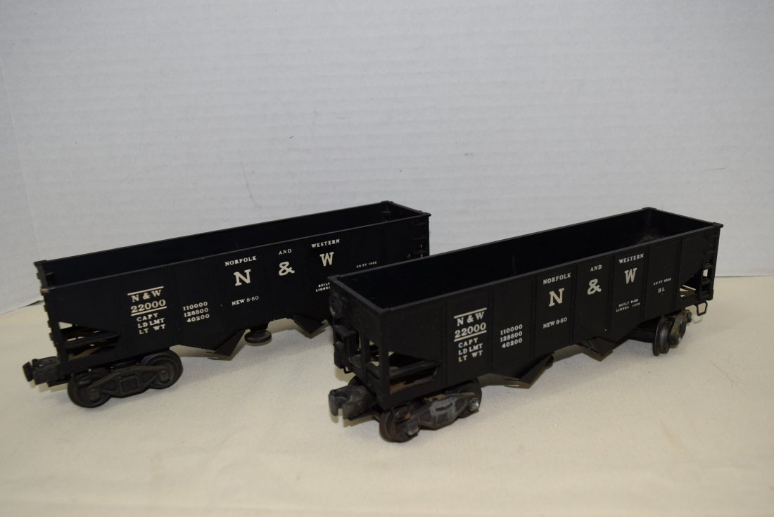 2 LIONEL N&W OPERATING HOPPERS: 2 LIONEL N&W OPERATING HOPPERS 3456. THE BOTTOM DOORS ON THE HOPPER DO OPEN AND CLOSE EASILY WITH PULLING THE KNOB ON THE BOTTOM. MINOR AREAS OF RUSTING ALONG SOME OF THE METAL ON ONE OF THE CARS. UNT
