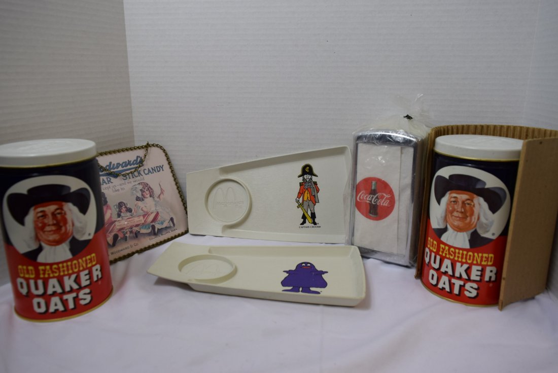 ADVERTISING COLLECTIBLES: 2 MCDONALDS KIDDIE MEAL TRAYS - GRIMACE AND CAPTION CROOK - BOTH PIECES HAVE SOME SCRATCHING THROUGH THE CHARACTER, 2 1982 QUAKER OATS LIMITED EDITION CANNISTERS - ONE IN ORIGINAL MAILING BOX, COCA CO