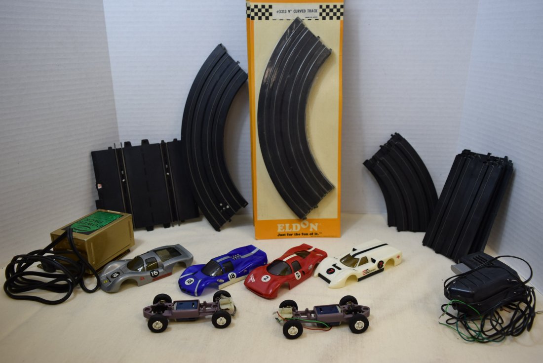 2 ELDON SLOT CARS-TRACKS AND MORE: 2 ELDON SLOT CARS WITH MOTORS & WHEELS -AGING OF WHEELS-FOUR INTERCHANGEABLE BODY CABS CHAPARRAL 1350-11-PORSCHE CARRERA 1351-11-FORD J 1350-12-P-3 FERRARI 1351-12-STRAIGHT & CURVED TRACKS-3 NIP 9'' C