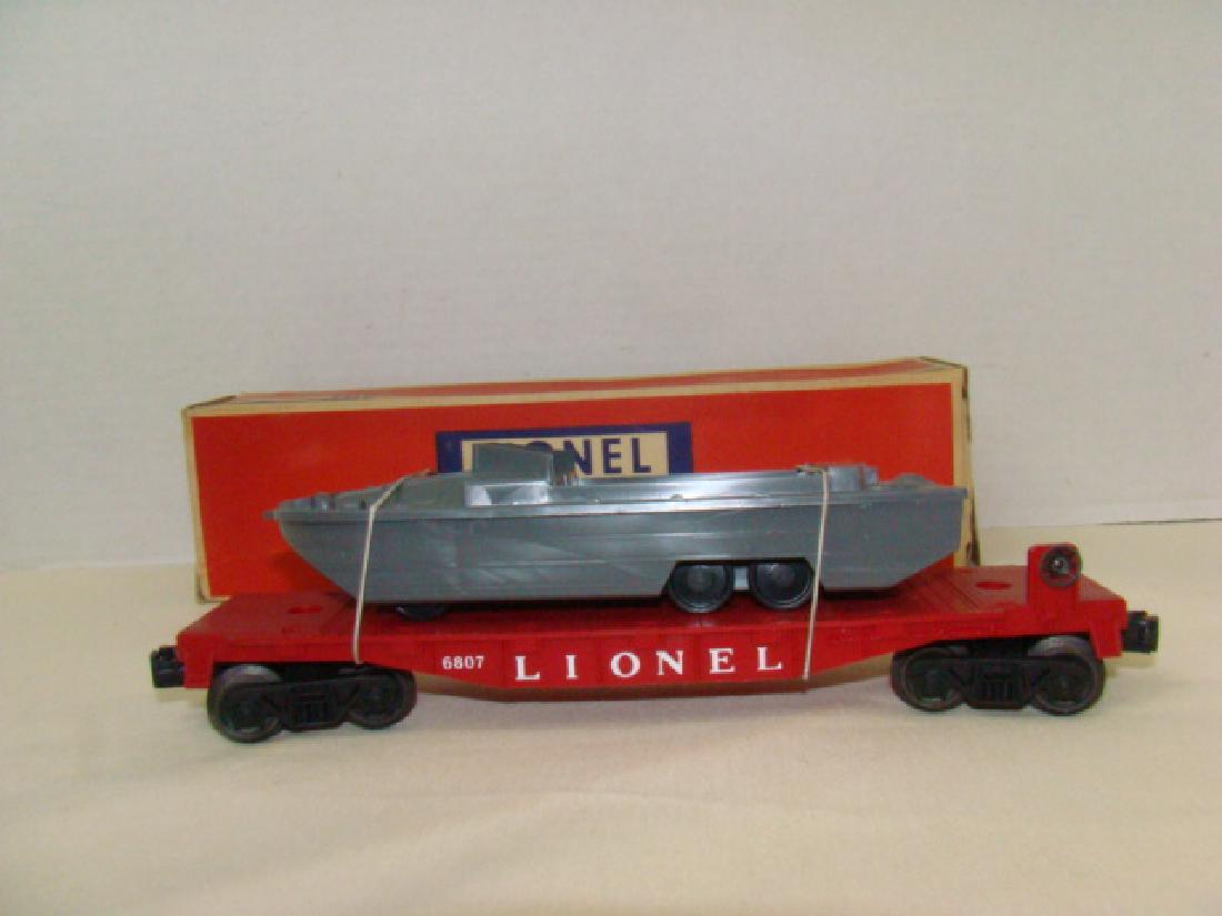 LIONEL FLAT CAR WITH USMC BOAT-ORIGINAL BOX: LIONEL TRAINS FLAT CAR WITH MILITARY UNIT -USMC PYRO BOAT 6807-ORIGINAL BOX- BOX DAMAGE-DENTS-FLAP TEAR/MISSING