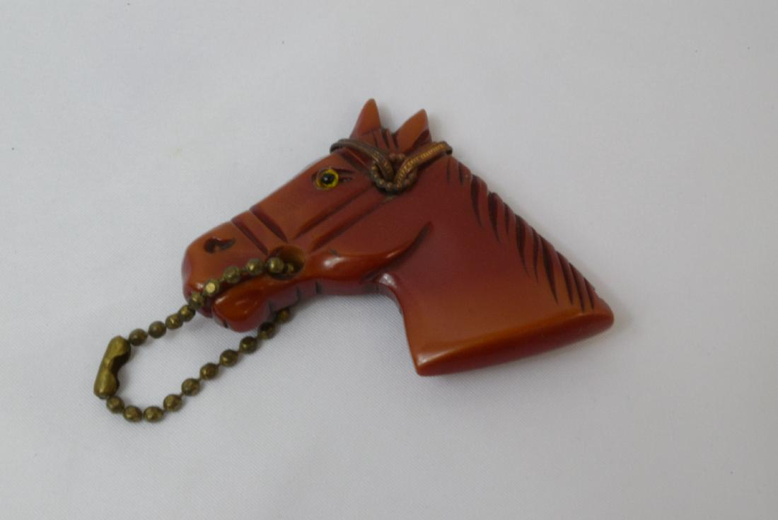 BAKELITE HORSEHEAD KEYCHAIN OR PIN: CARVED AND OVERDYED BRONZE HEARHEAD-CHAIN REINS-GLASS & BEAD EYE-PIN BACK OR KEYCHAIN