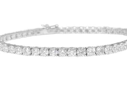 VVS 9.10 Carat Diamond Tennis Bracelet 14K White Gold: Metal: 14k white gold. Diamonds: 9.10 carats total. Round brilliant cut diamonds. VVS clarity. 00% natural earth mined diamonds 20 pointer diamonds. Setting: prongs. Style: Tennis bracelet. Tongue