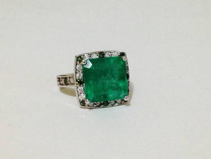 14k White Gold Emerald And Green Diamond Ring: 14k White Gold Emerald And Green Diamond Ring, 1.20 carat Green Diamond G color, SI Clarity, 7.5 carat Natural Colombian Emerald ESTIMATED RETAIL REPLACEMENT VALUE $17,550. CERTIFIED BY AGI NY