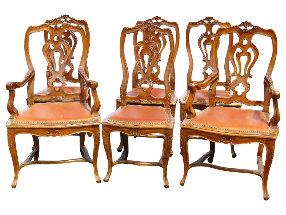 6 LOUIS XVI STYLE CARVED WALNUT DINING CHAIRS: Carved walnut frames with floral decoration. Brown leather seats. 43"h. x 24 1/2"w. x 23"d.