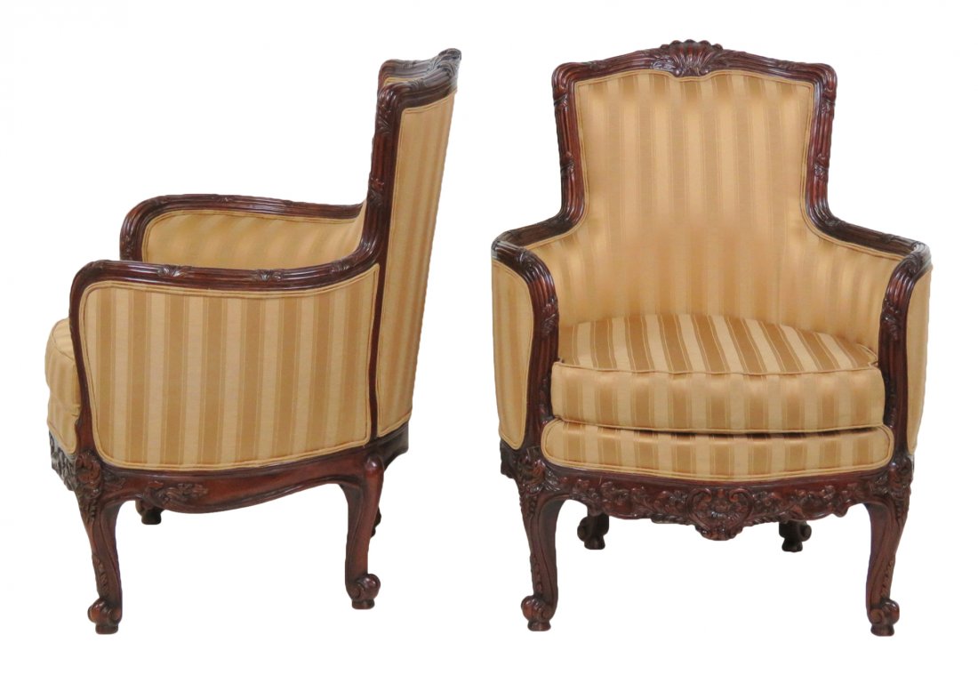 Pair CARVED MAHOGANY UPHOLSTERED BERGERES: Carved mahogany frame with cream and brown striped upholstery. 30 1/4\"h. x 31 1/4\"w. x 29\"d.