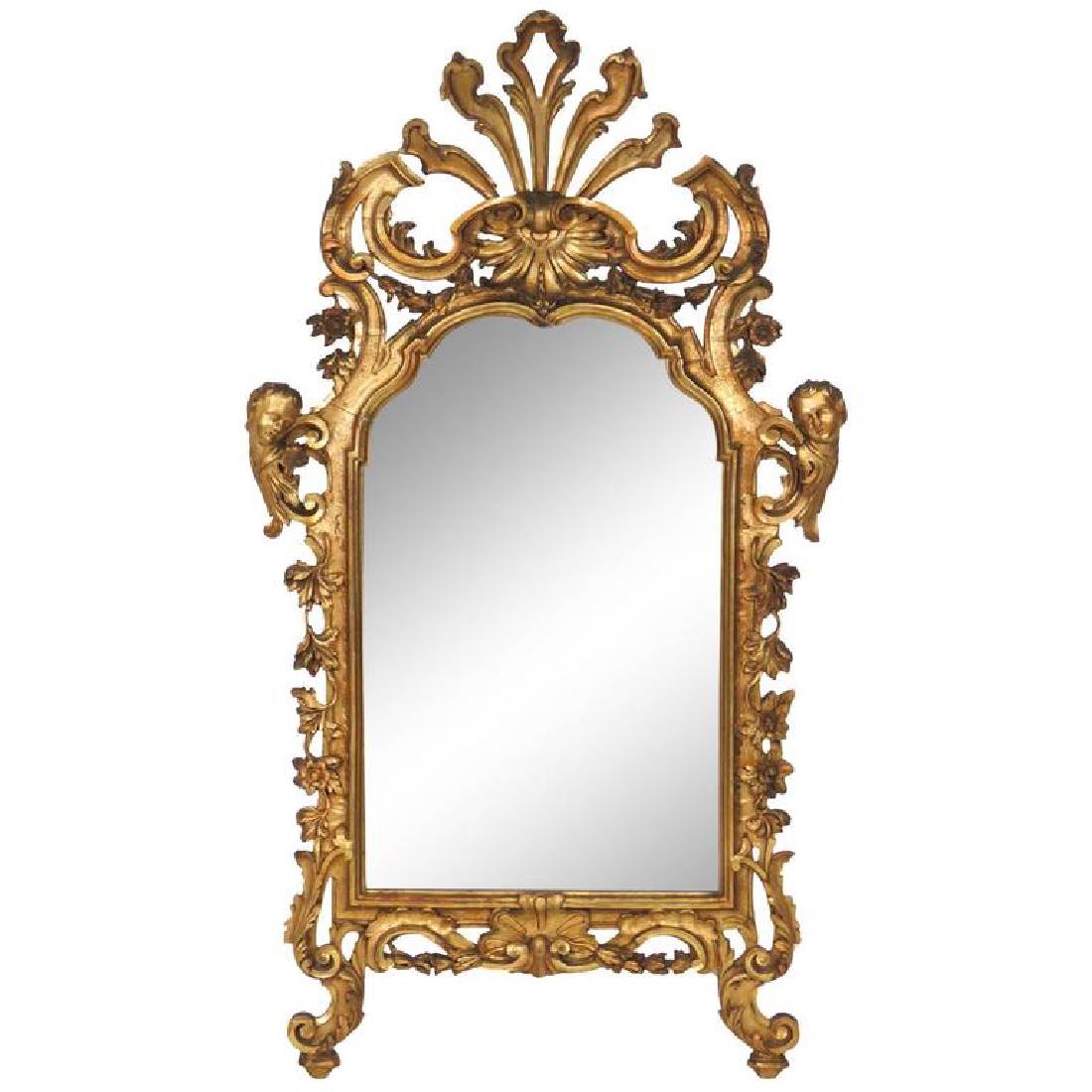 Antique Italian Carved Gilt Mirror: Carved giltwood with cherub heads. 67"h x 37 1/4"w x 3"d