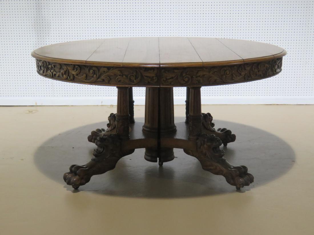 HORNER STYLE DINING TABLE: Round. Oak. Three 14 3/4" leaves. 30 1/2" h x 60" diameter. With leaves 105".