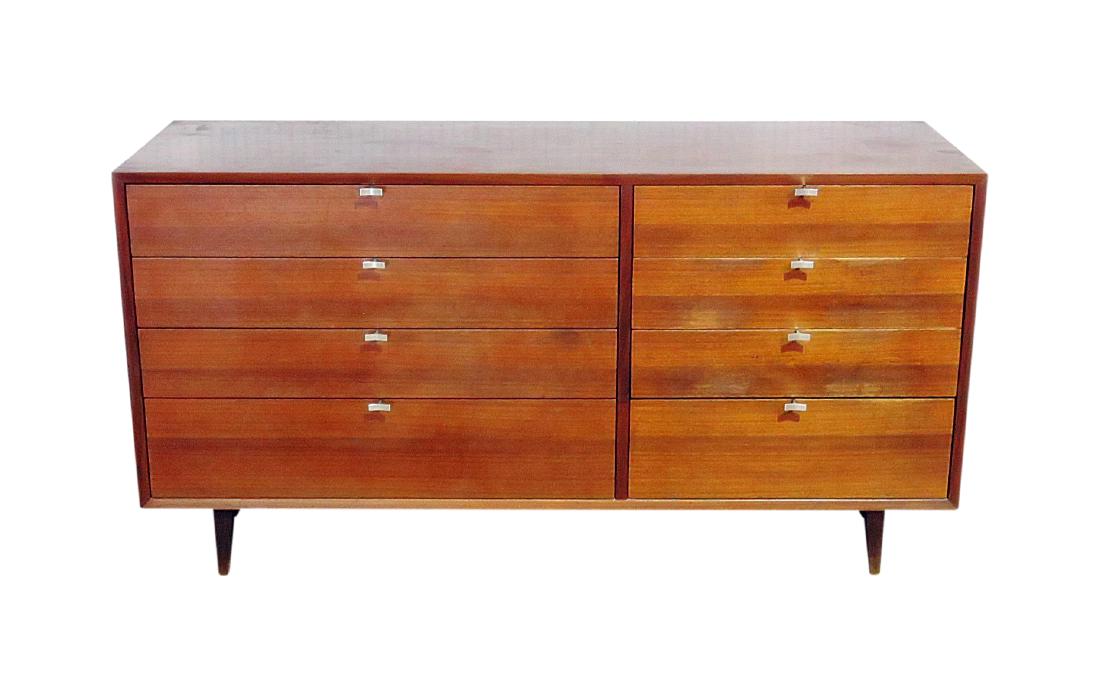 HERMAN MILLER WALNUT DRESSER: Eight drawers. Walnut. 29 3/4" h x 57 1/8" w x 18 1/2" d.