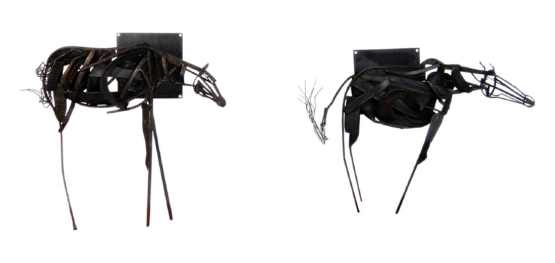 Pair METAL HORSE SCULPTURES stamped R S TOLL: Signed J. Kuhn 4/09. R S Toll. Wall mounted. Larger one measures 22 1/4" h x 28" w x 20 1/2" d. Smaller one - 21 1/2" h x 28 1/2" w x 18" d.