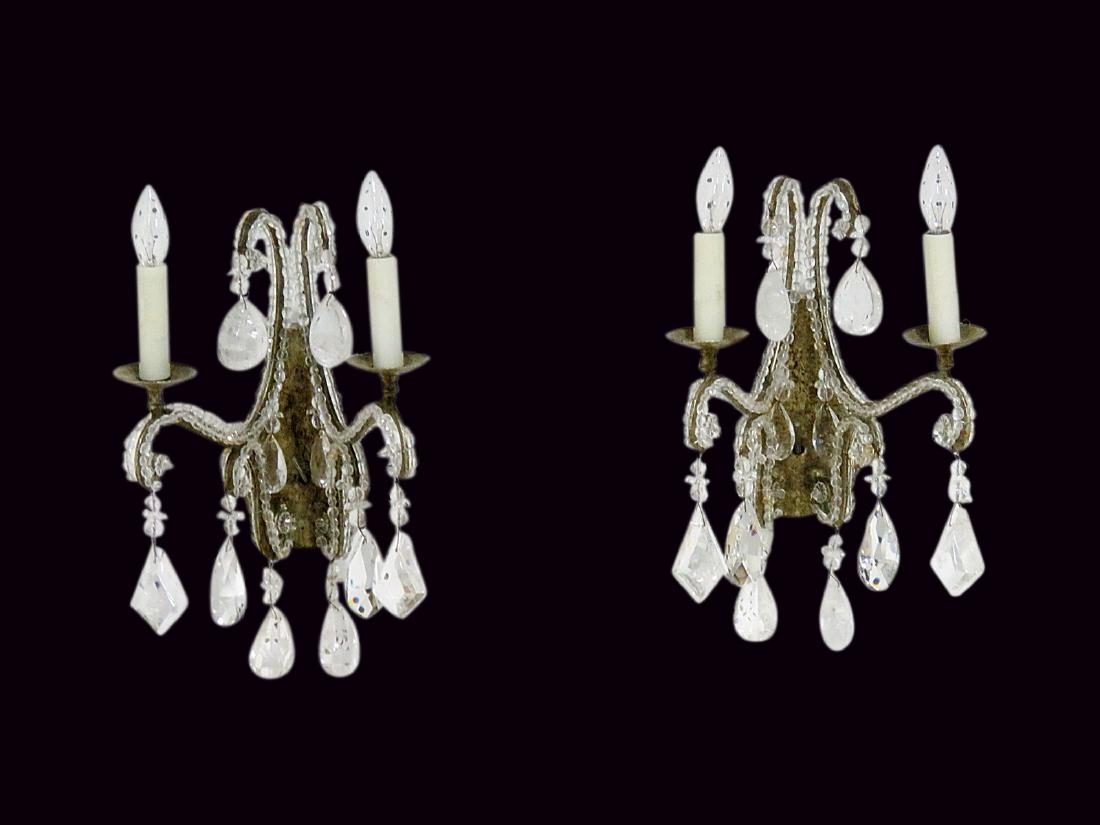 Pair BAGUES BEADWORK & ROCK CRYSTAL SCONCES: Distressed metal frame. Crystal beadwork and prisms. Rock crystals. 17" h x 9 3/4" w x 12" d.