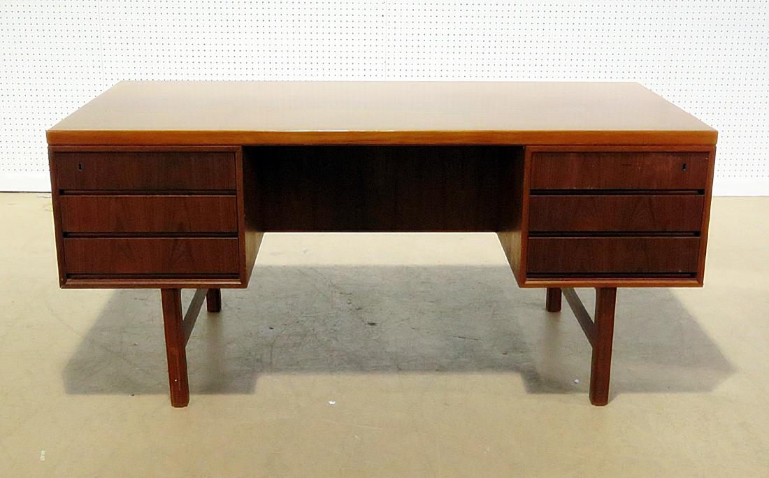 OMANN JUN TEAK FLAT DESK: 6 drawers in front. Dovetailed. Back has 2 open shelves and one door. No key. 28 " h x 61 1/4" w x 31" d.