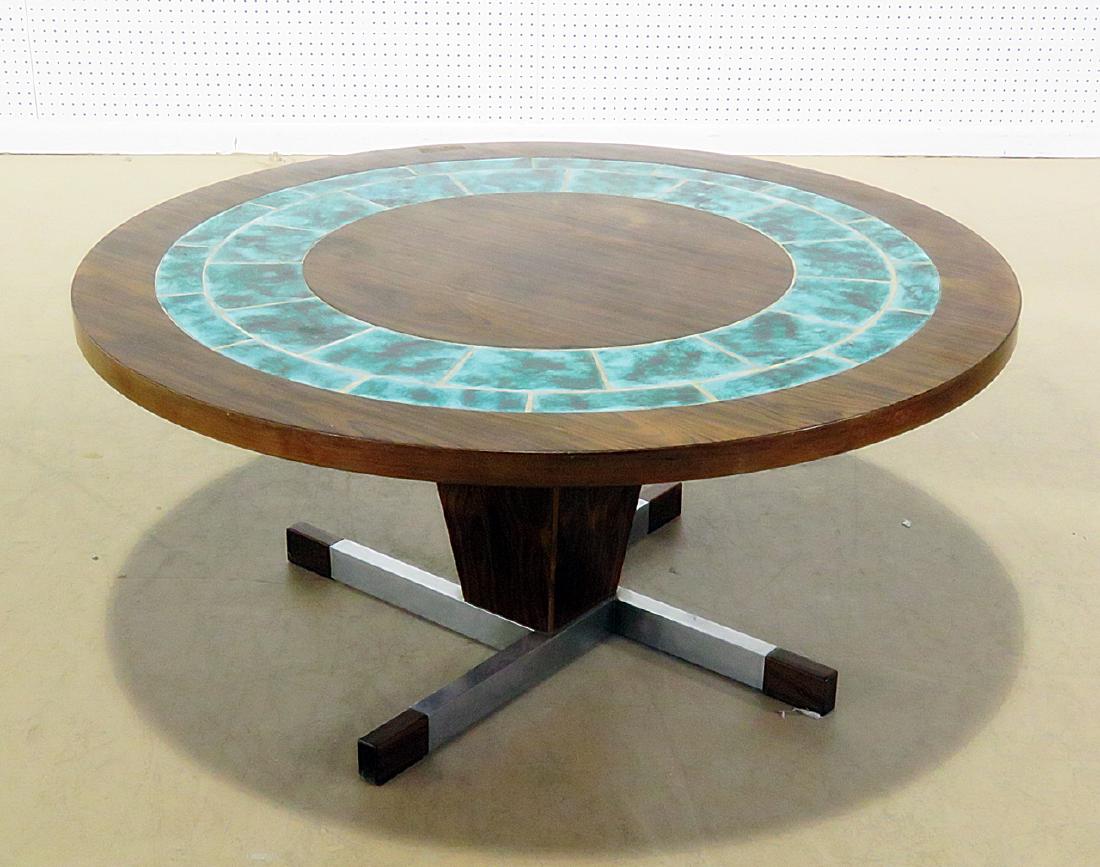 TILE & ROSEWOOD COFFEE TABLE: Rosewood. Tile insert. Chrome accent on base. 20 1/2" h x 43 1/2" diameter.