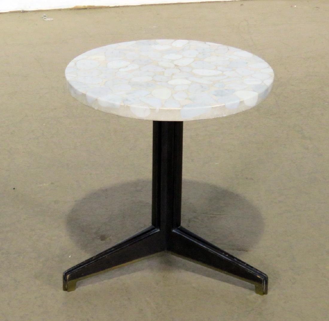 DUNBAR END TABLE: Specimen top. Walnut and brass insert legs. 15 7/8" h x 15 1/8" diameter.