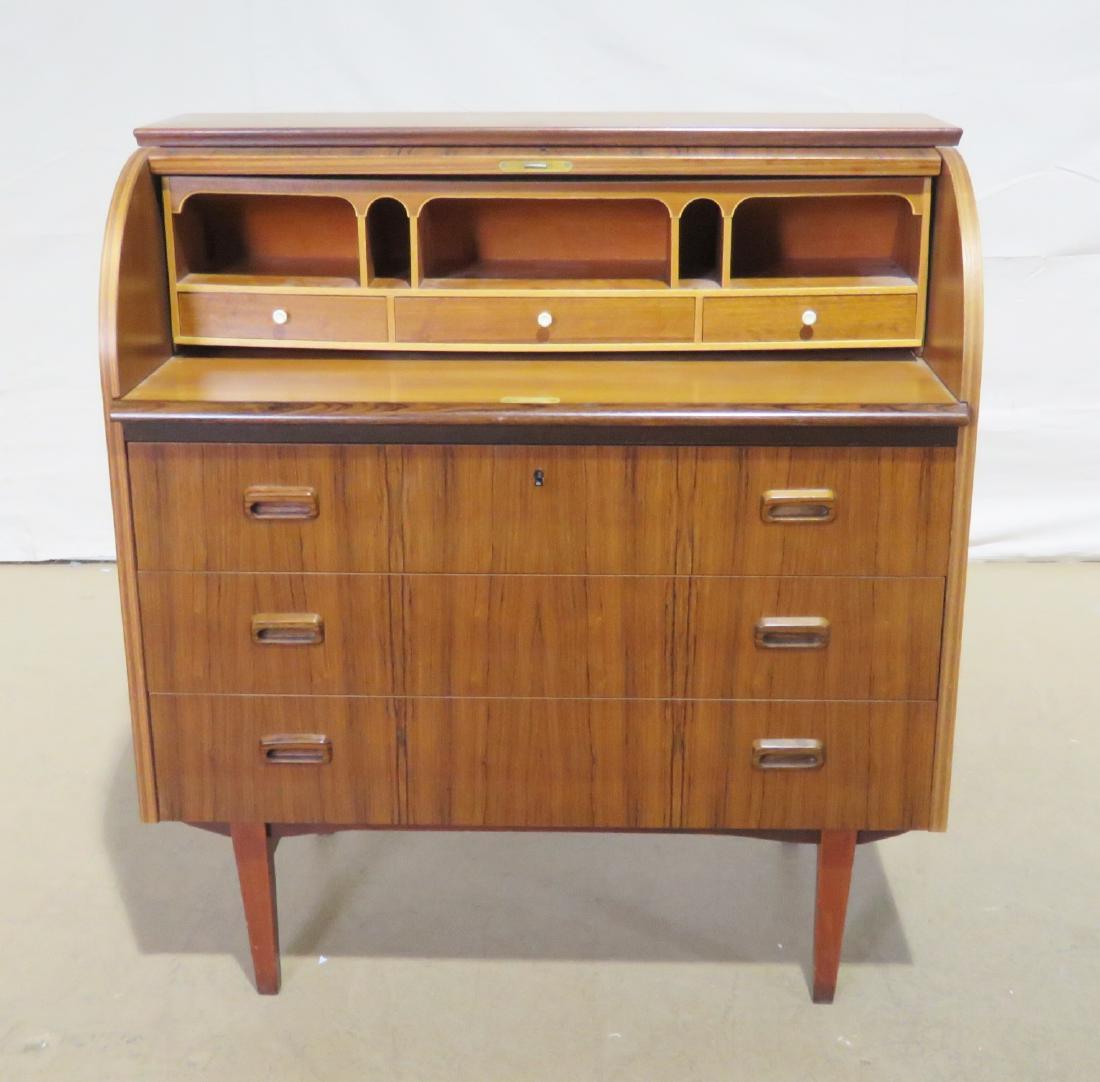 DANISH CYLINDER DESK: Roll up top containing 3 drawers and 5 slots. Bottom has 3 drawers. 38 1/8" h x 35 3/8" w x 18 5/8" d.