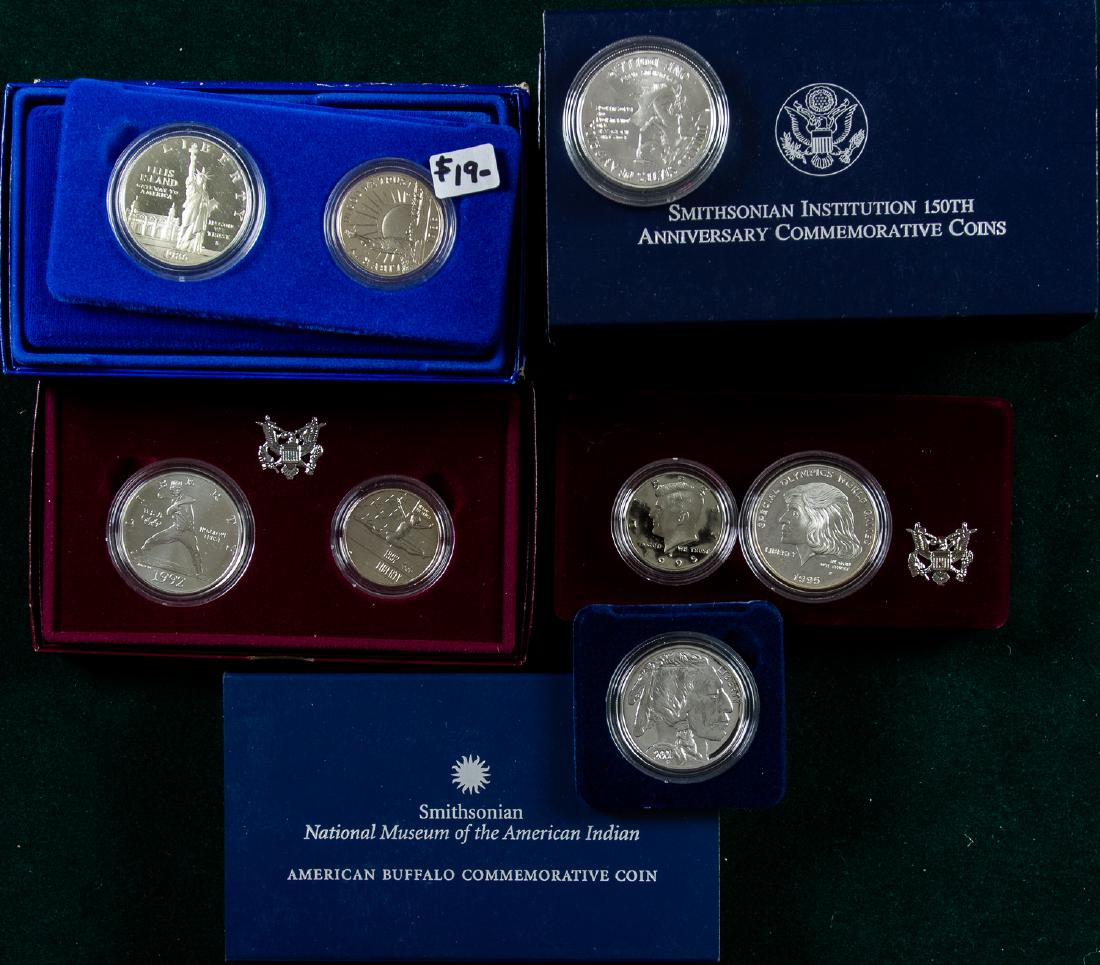 8 COMMEMORATIVE COIN SETS (1 of 2)