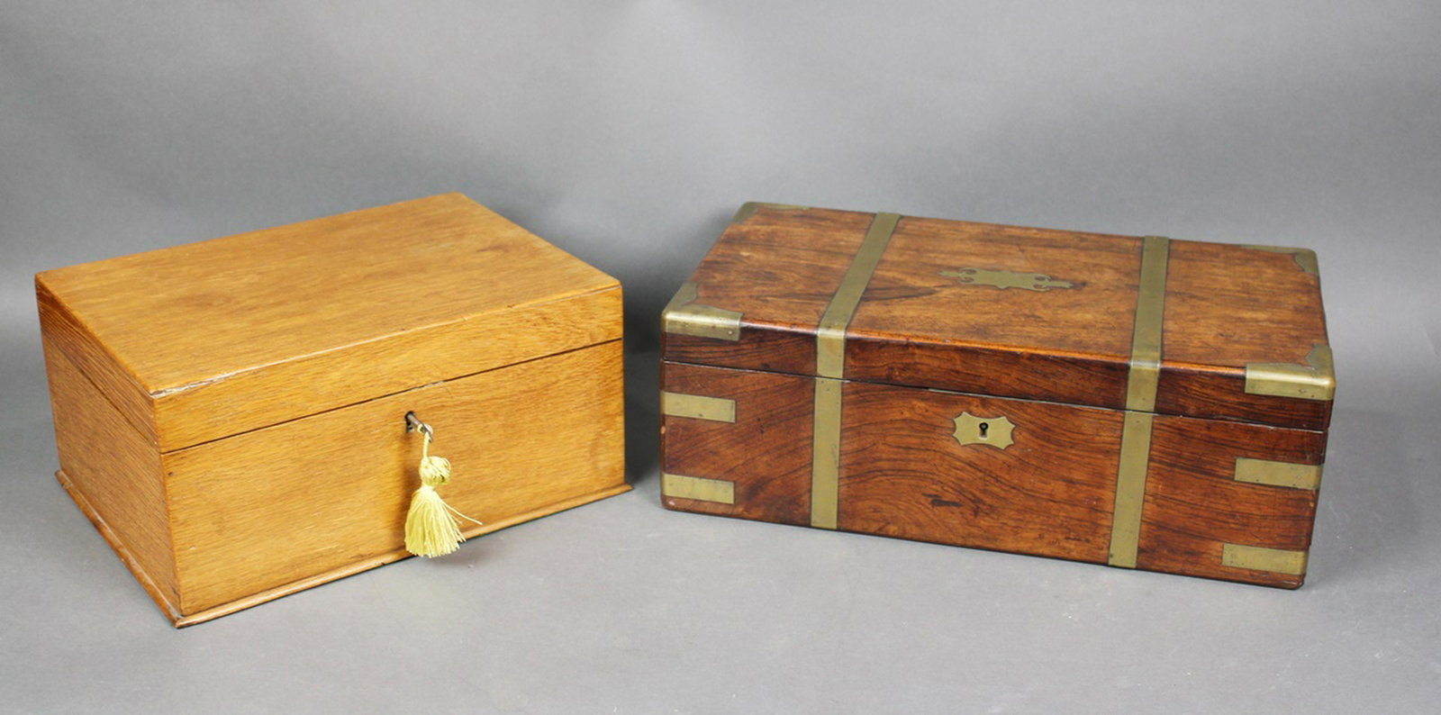 2 LAP DESKS/WRITING SLOPES: Leather interior, multi compartments. Working lock w/key. 7" h x 14" w x 11" d Campaign style w/brass details. 6 3/4" h x 18 3/8" w x 10 1/2" d