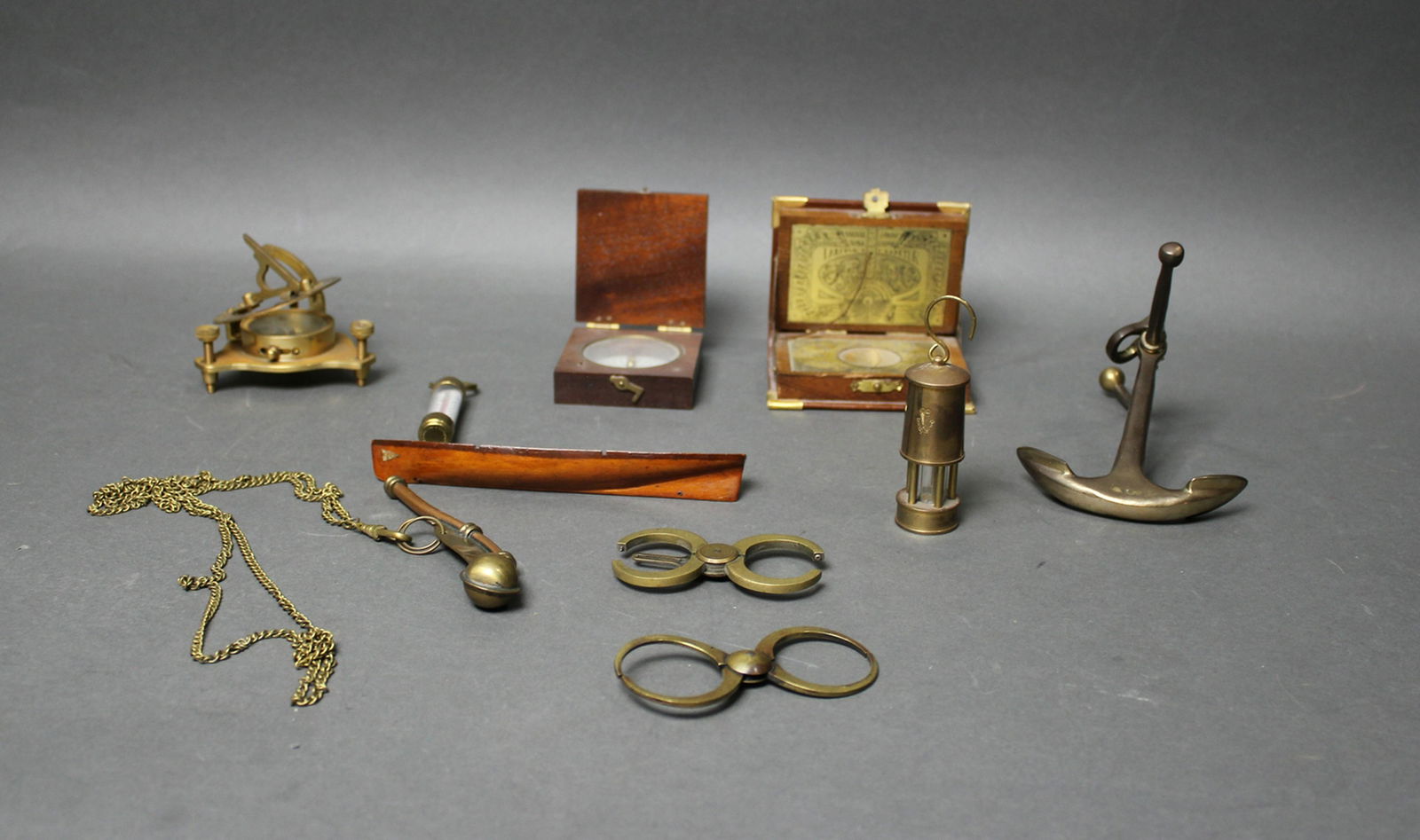 10 NAUTICAL MINIATURES: Carved canoe 6 1/2" l; Sundials, compasses etc. Lengths from 3 3/4" to 6"