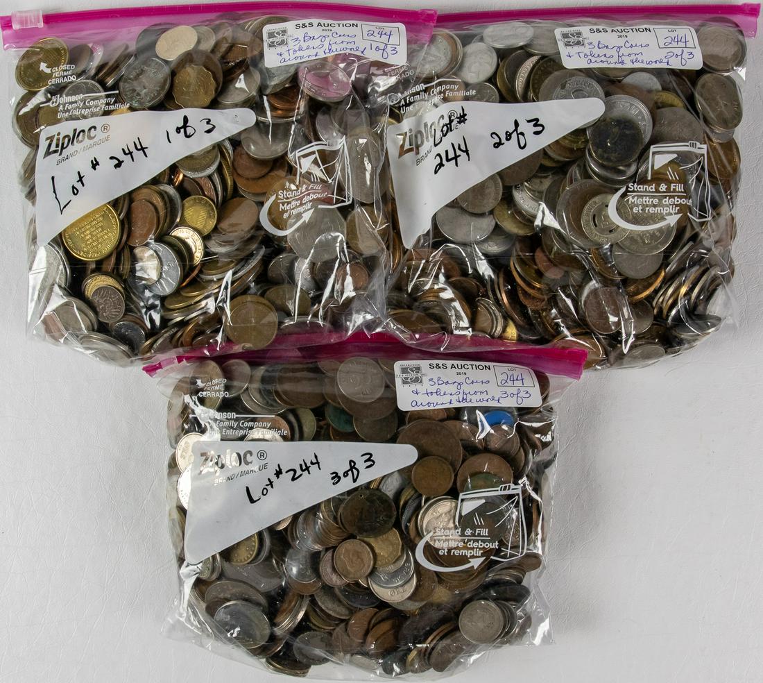 3 BAGS FULL OF ASSORTED COINS AND TOKENS FROM AROUND (1 of 2)