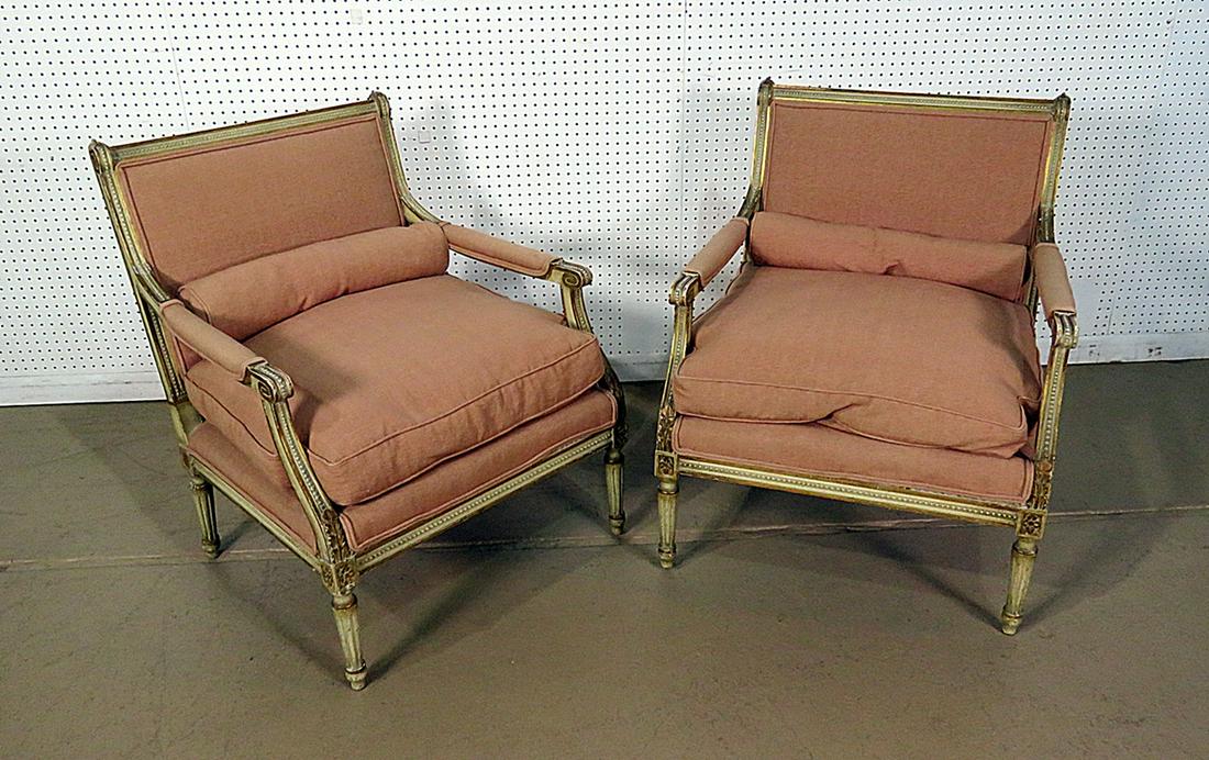 PAIR LOUIS XVI STYLE MARQUIS: Carved. Cream painted with parcel gilt trim. Mauve upholstery with down filled cushions. 34 1/4" h x 28 1/2" w x 28" d. Seat height 20".