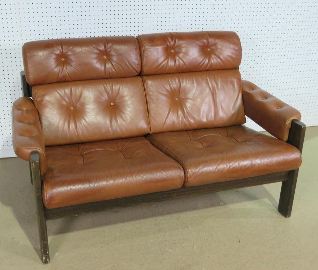 LAFER STYLE OAK AND LEATHER LOVESEAT: Oak frame. Leather upholstery. Tufted. 32 1/2" h x 65" w x 32" d. Seat height 16 7/8".