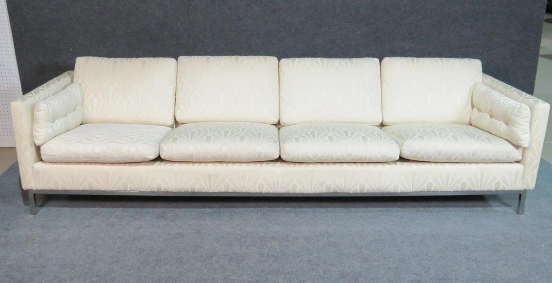 KNOLL SOFA: Chrome frame. Upholstered. Has two side pillows. 29" h x 107" w x 34 1/8" d. Seat height 18".