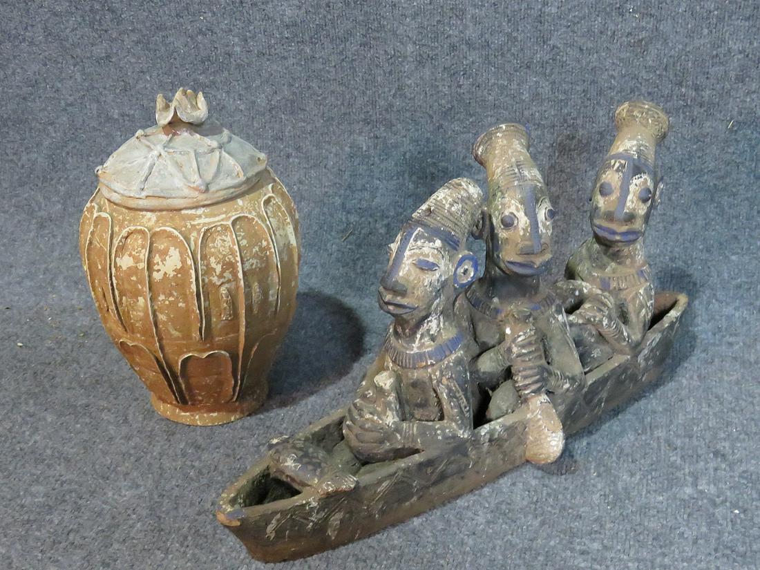 CLAY LIDDED POT AND TRIBAL FIGURES IN BOAT: Clay pot measures 12 1/2" h x 7 1/2" diameter. Clay tribal figures in boat measures 11" h x 5 7/8" w x 20 1/2" d.