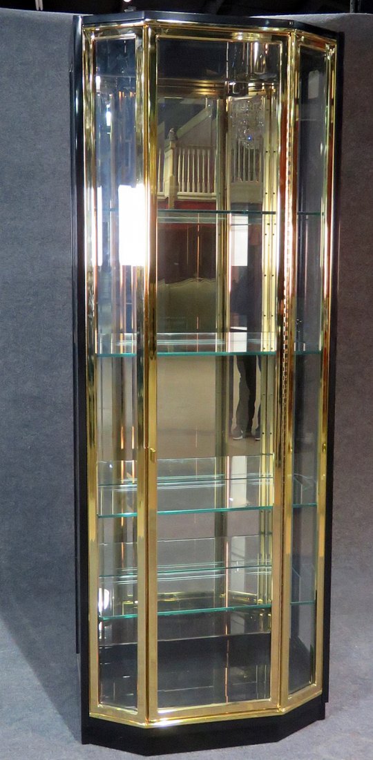 HENREDON ONE DOOR ETAGERE: Signed Henredon. Beveled glass. One door. Brass plated. 4 glass shelves. 82" h x 30" w x 17" d.