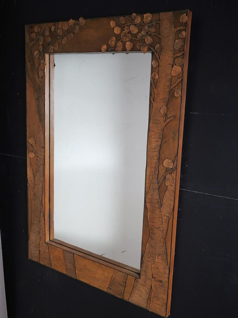 LEATHER STUDIO LEAF & BRANCH MIRROR: All hand crafted studio made mirror with insert mirror. 47 1/2" h x 32 1/2" w x 1 1/4" d.