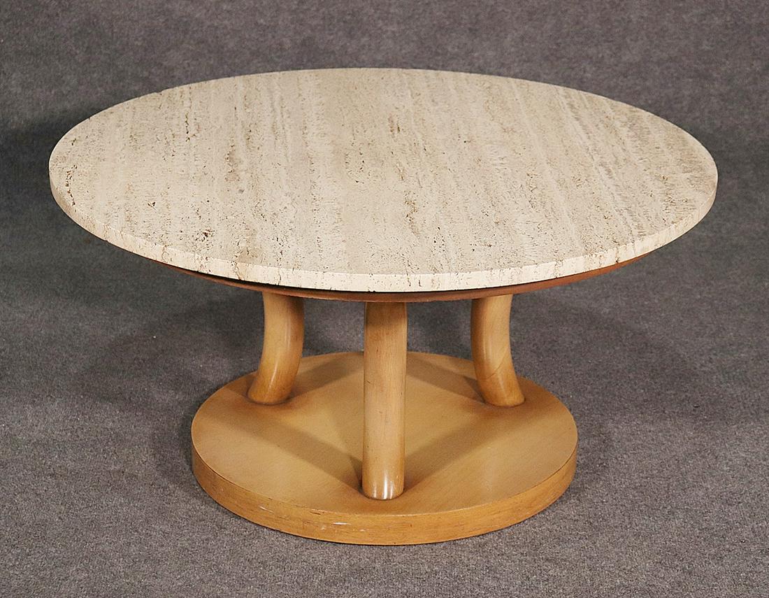 COFFEE TABLE ATTRIBUTED TO ROBSJOHN GIBBINGS: Blonde mahogany base with travertine top. 18 1/4" h x 36" diameter