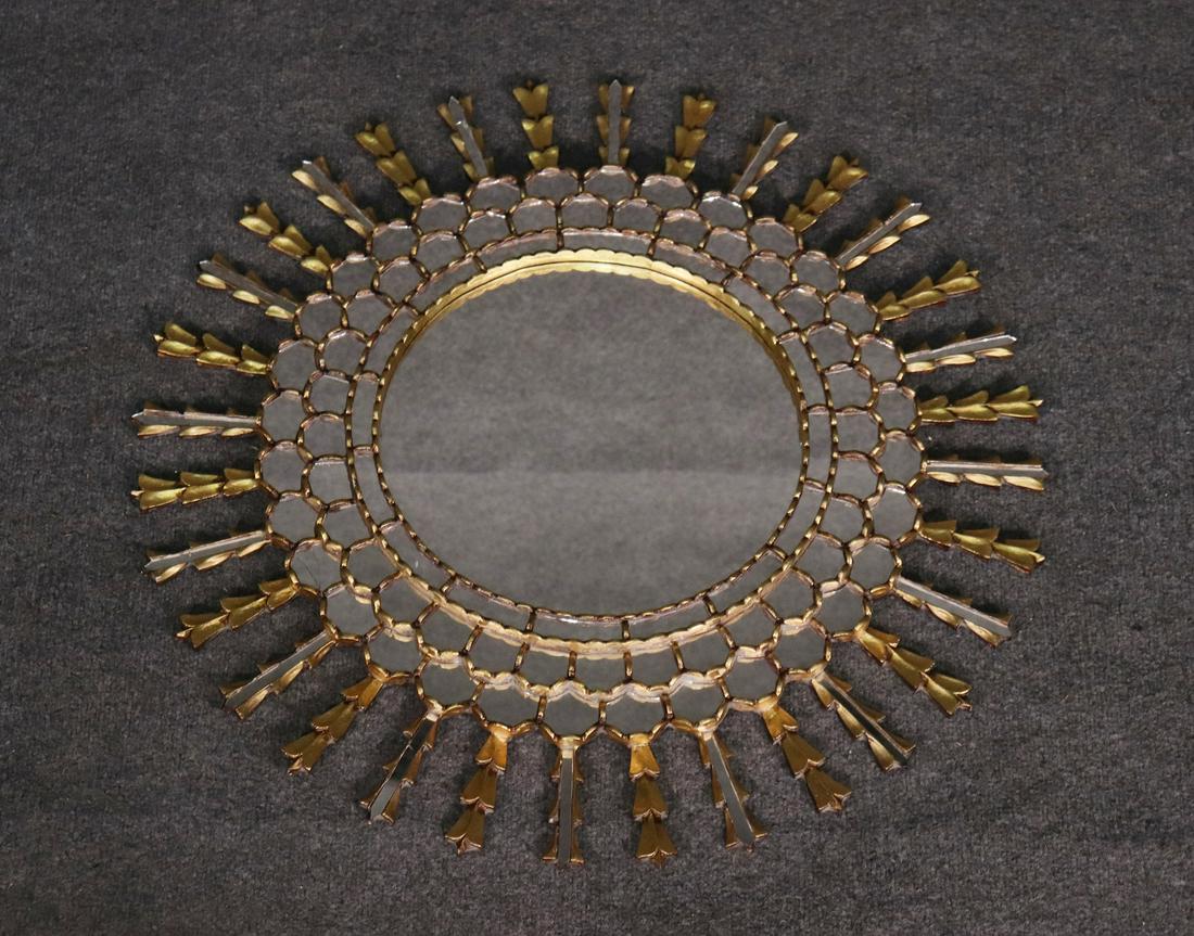 ITALIAN GILTWOOD SUNBURST MIRROR: Gilt wood with inset mirror decor and center section. 30" diameter.