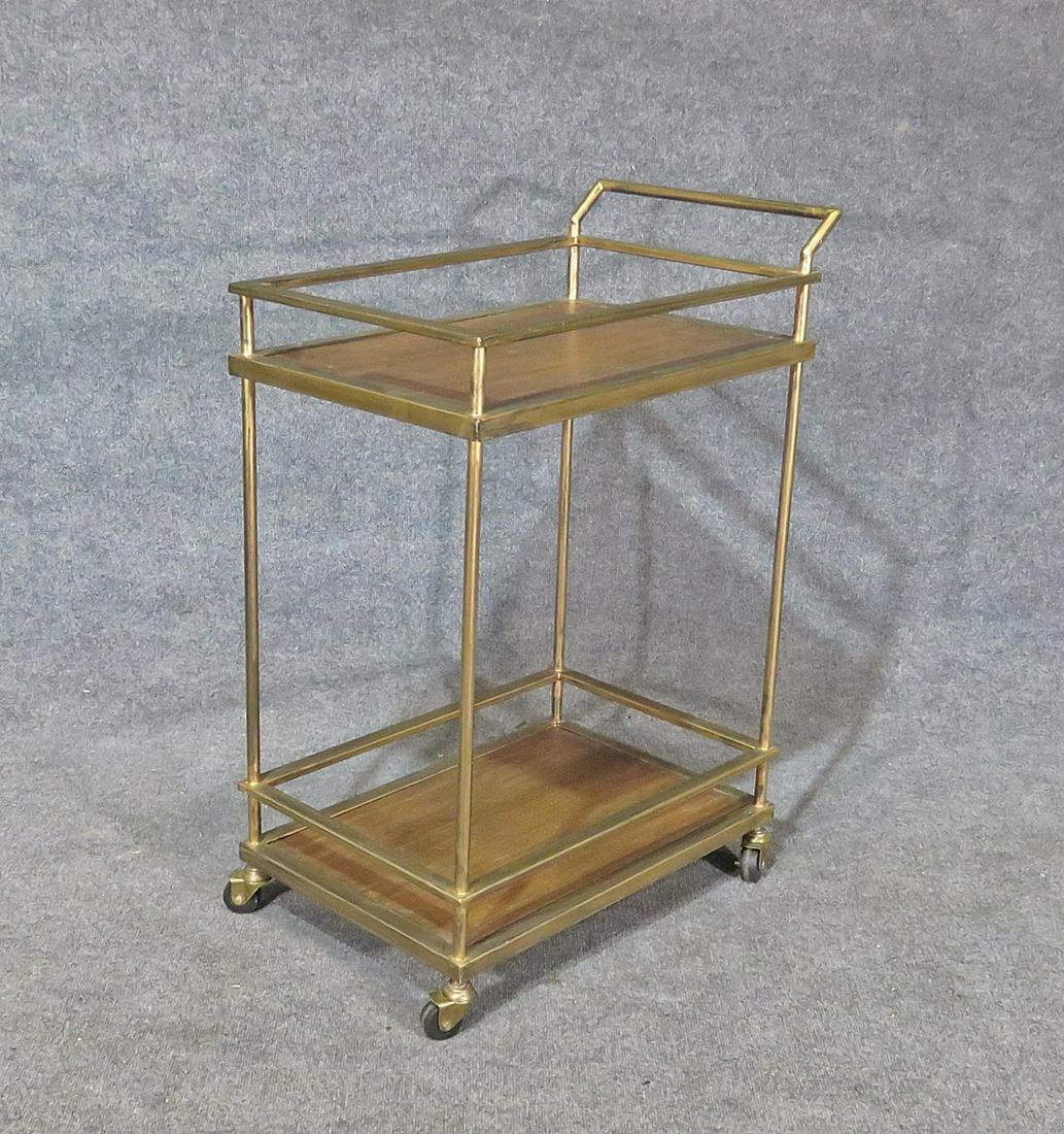 MID CENTURY MODERN BAR CART: Metal frame. Two tier. On rollers. 36" h x 16 1/2" w x 25 3/4" d.