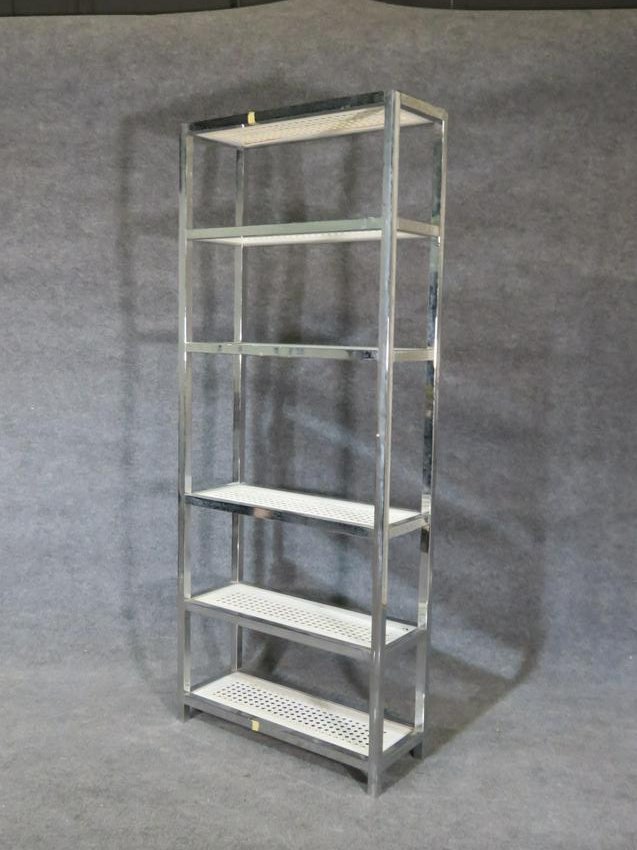 CHROME ETAGERE: Chrome frame. 5 shelves. 79" h x 32" w x 12" d.