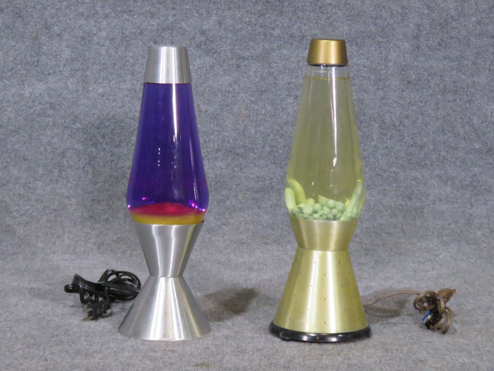 PAIR LAVA LAMPS: One blue shade. One gold colored shade. 17 3/4" h X 7 1/2" diameter.