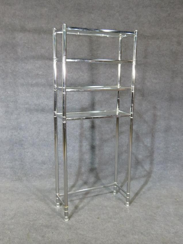 CHROME ETAGERE: Chrome frame. 4 glass shelves. 64" h x 26" w x 11 1/2" d.