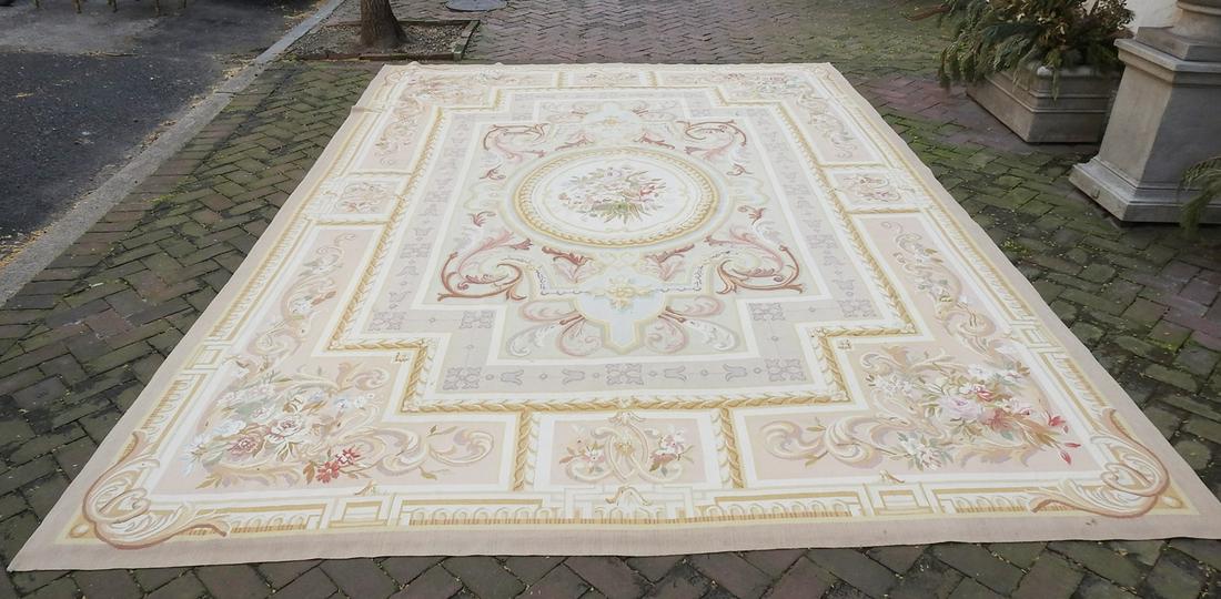 AUBUSSON RUG: Tan, gold and brown colored. 168" x 115 1/2".