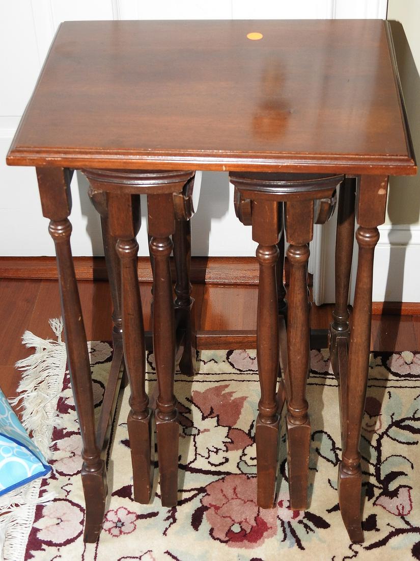 NESTING TABLES: Wood. 3 tables. Tables fold up. 25 3/4" h x 17" w x 13 3/4" d.
