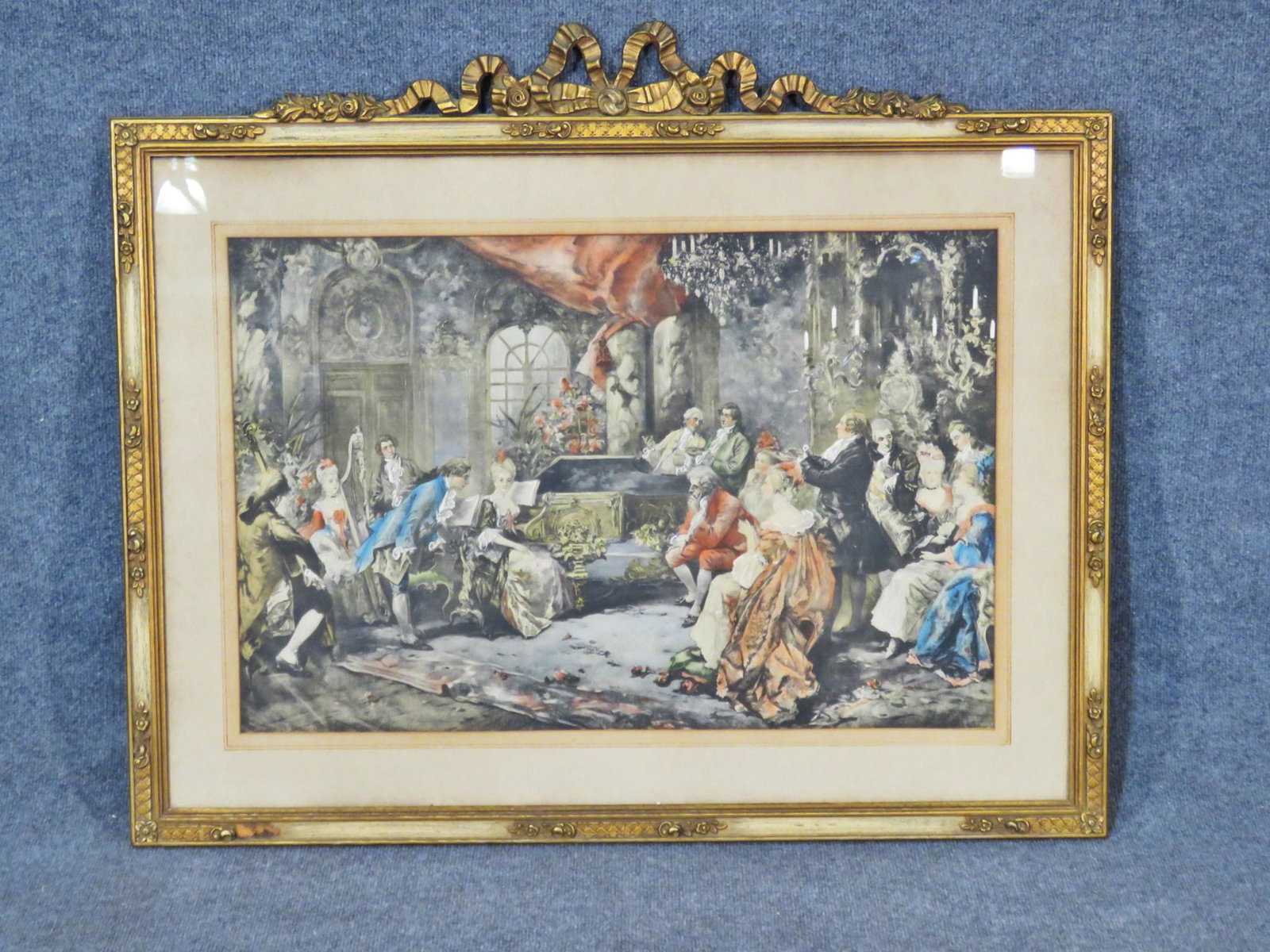 PRINT OF PEOPLE AND PIANO: Gilt painted frame. Under glass. 32 1/2" h x 38 1/2" w x 1" d.