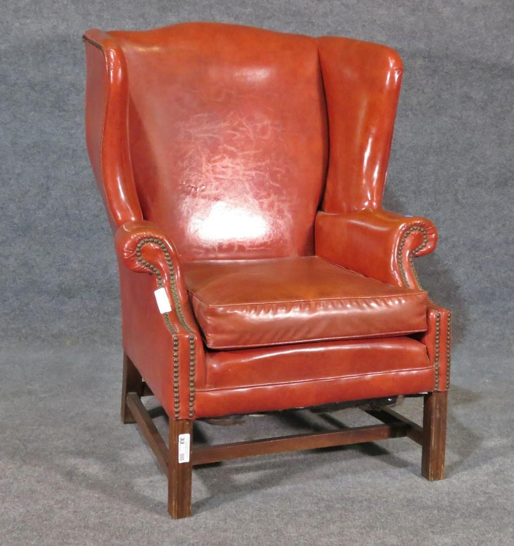 VINYL WING BACK CHAIR: Nail head trim. Vinyl upholstery. Wood frame. 43 1/4" h x 32" w x 31" d. Seat height 20".
