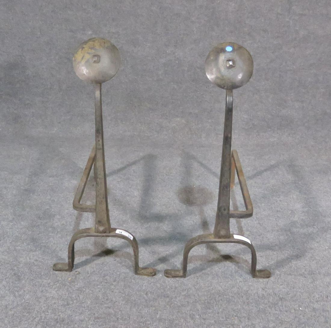 WROUGHT IRON ANDIRONS: Wrought iron. 33" h x 13 1/2" w x 31 1/2" d.