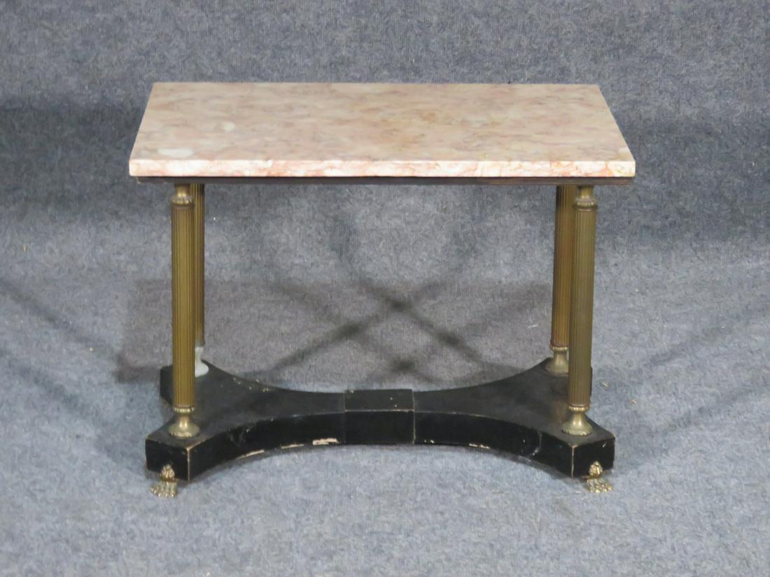 MARBLE TOP TABLE: Marble top. Brass legs and feet. Ebonized base. 18" h x 24" w x 15 3/4" d.