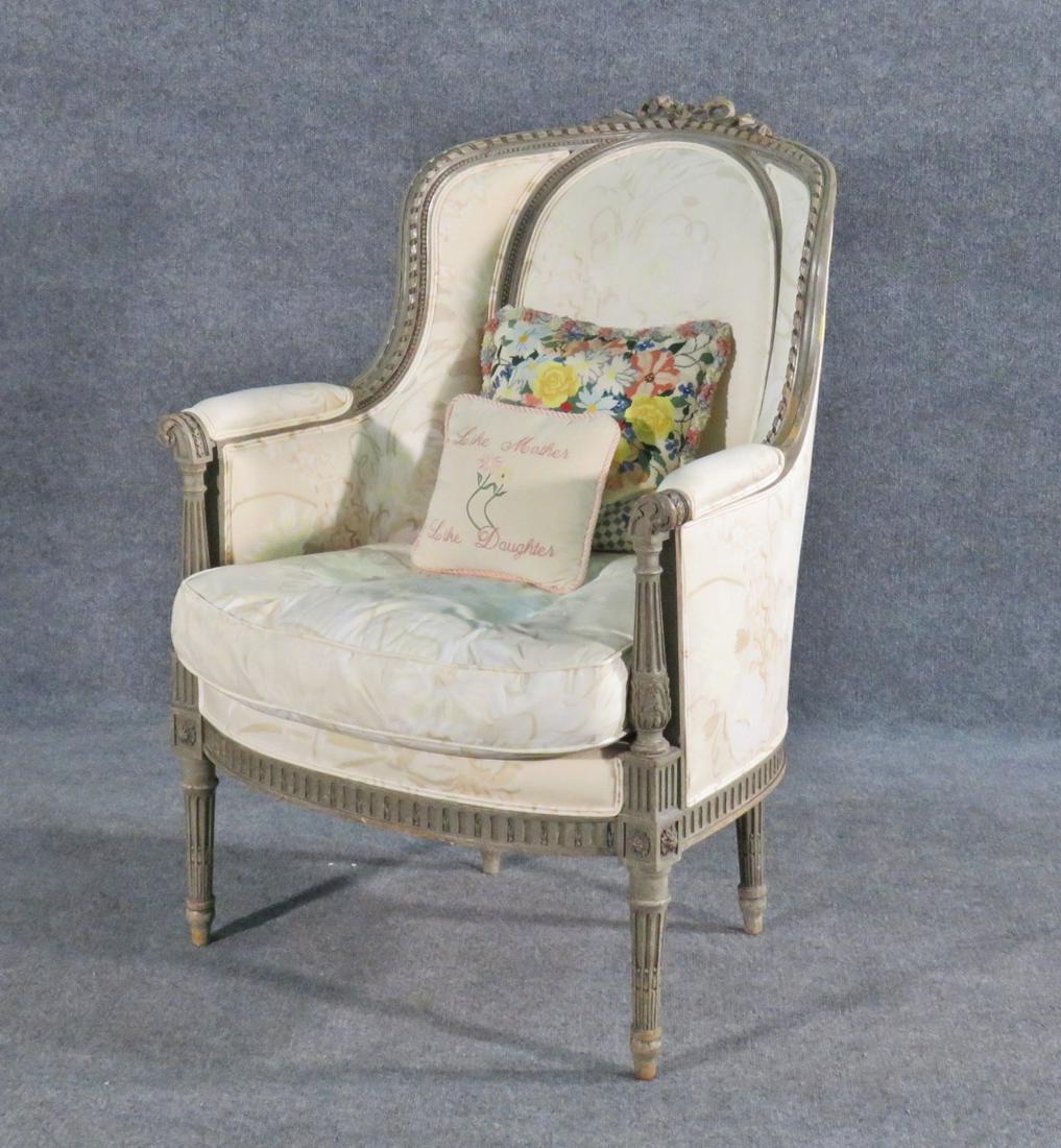 LOUIS XVI STYLE BERGERE: Carved wood frame. Upholstered. 40" h x 27 3/4" w x 28" d. Seat height 18 1/2".
