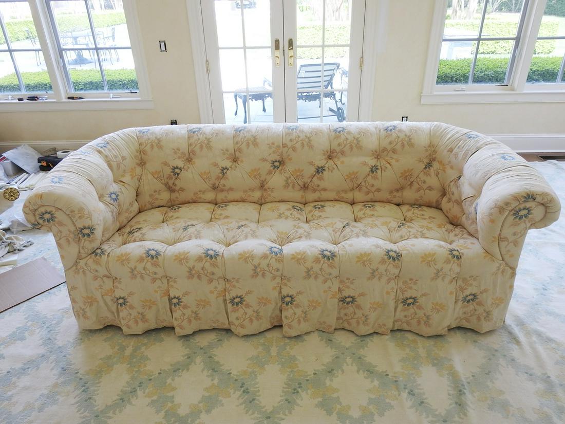 TUFTED SOFA: Tufted back and seat. Upholstered. Wood legs. 33" h x 92" w x 38" d. Seat height 18".