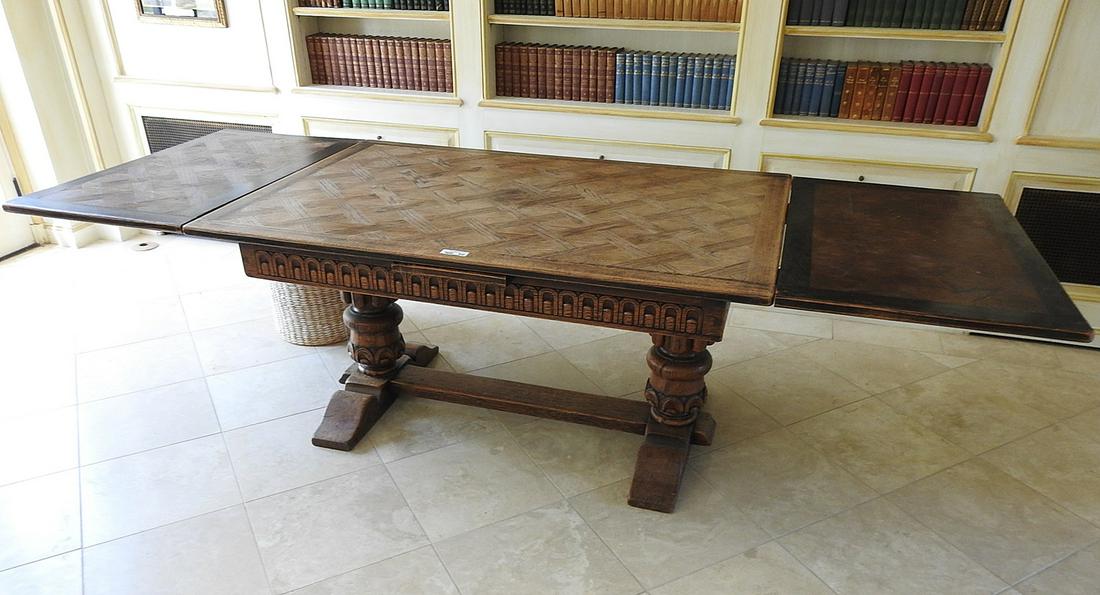 ELIZABETHAN STYLE REFACTORY DINING TABLE: Parquetry top with carved base.