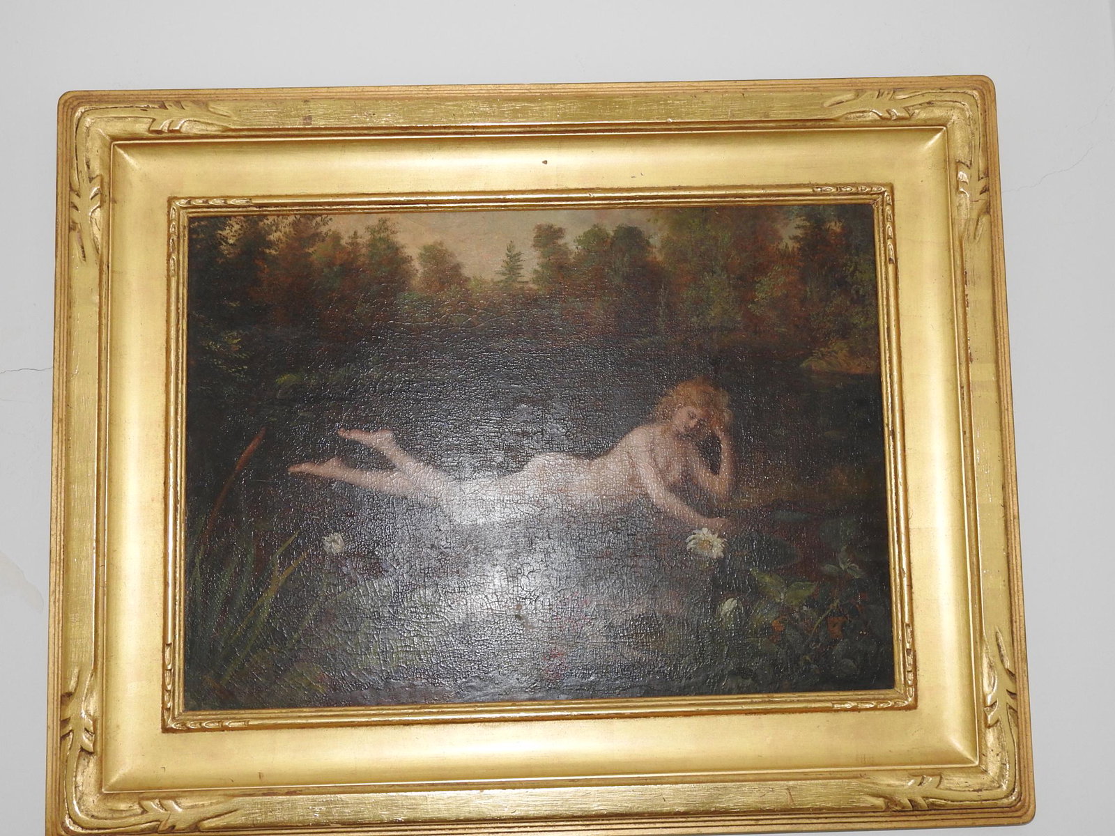 OIL PAINTING RECLINING NUDE SIGNED M.L. WAGNER: Signed in lower left corner. Gilded frame. Framed measures 17" h x 27 3/4" w. Picture measures 16 3/4" h x 24" w.