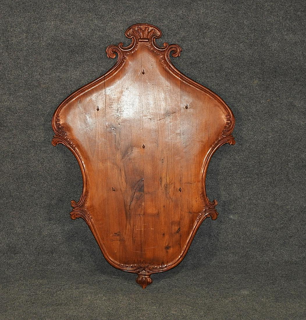 ITALIAN CARVED COLLECTORS RACK: Carved walnut with brass hooks. 46 3/4" h x 32 1/4" w.