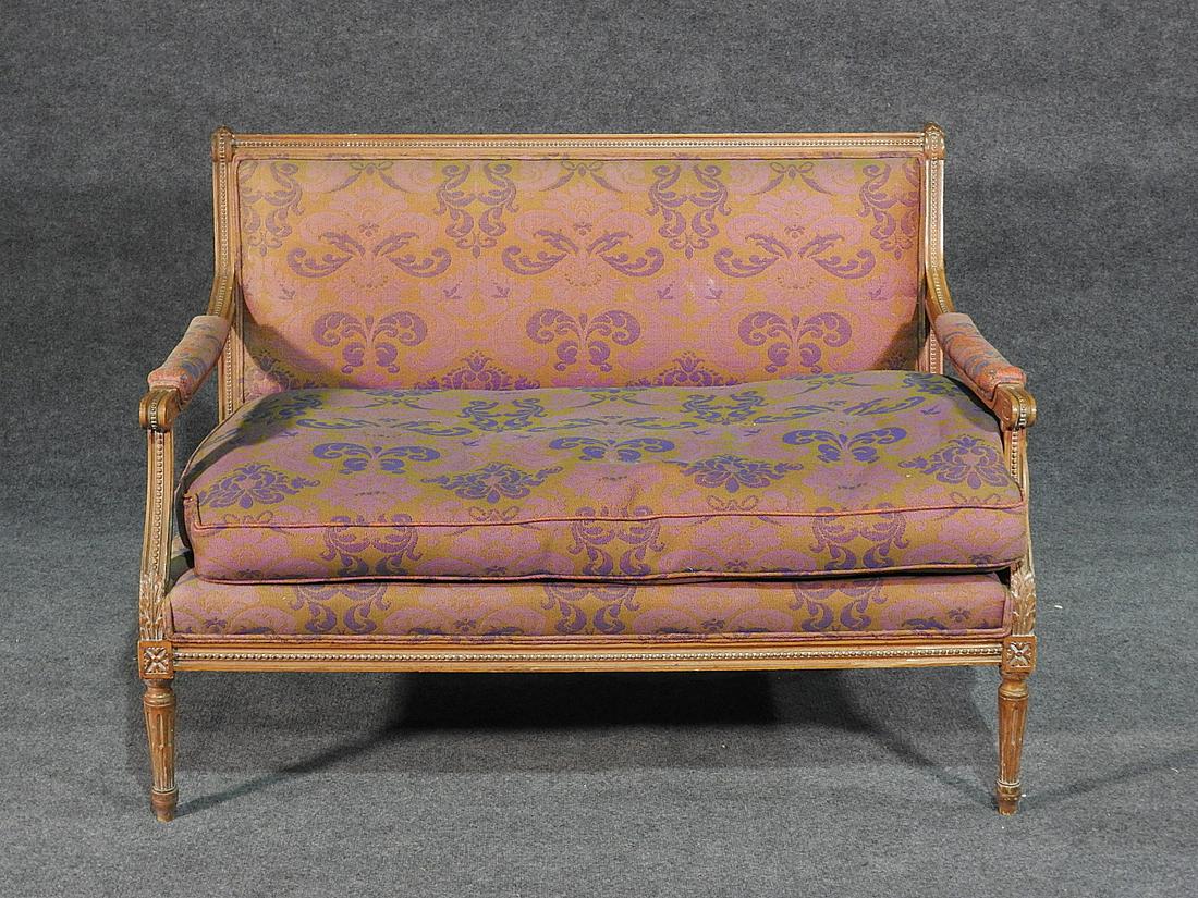 LOUIS XVI STYLE SETTEE: Carve wood frame. Upholstered. 34" h x 45" w x 29 1/2" d. Seat height 19".